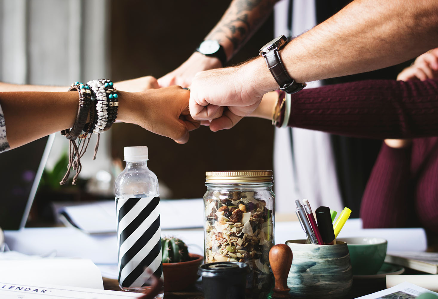 people fist bumping when succesfully hiring talent